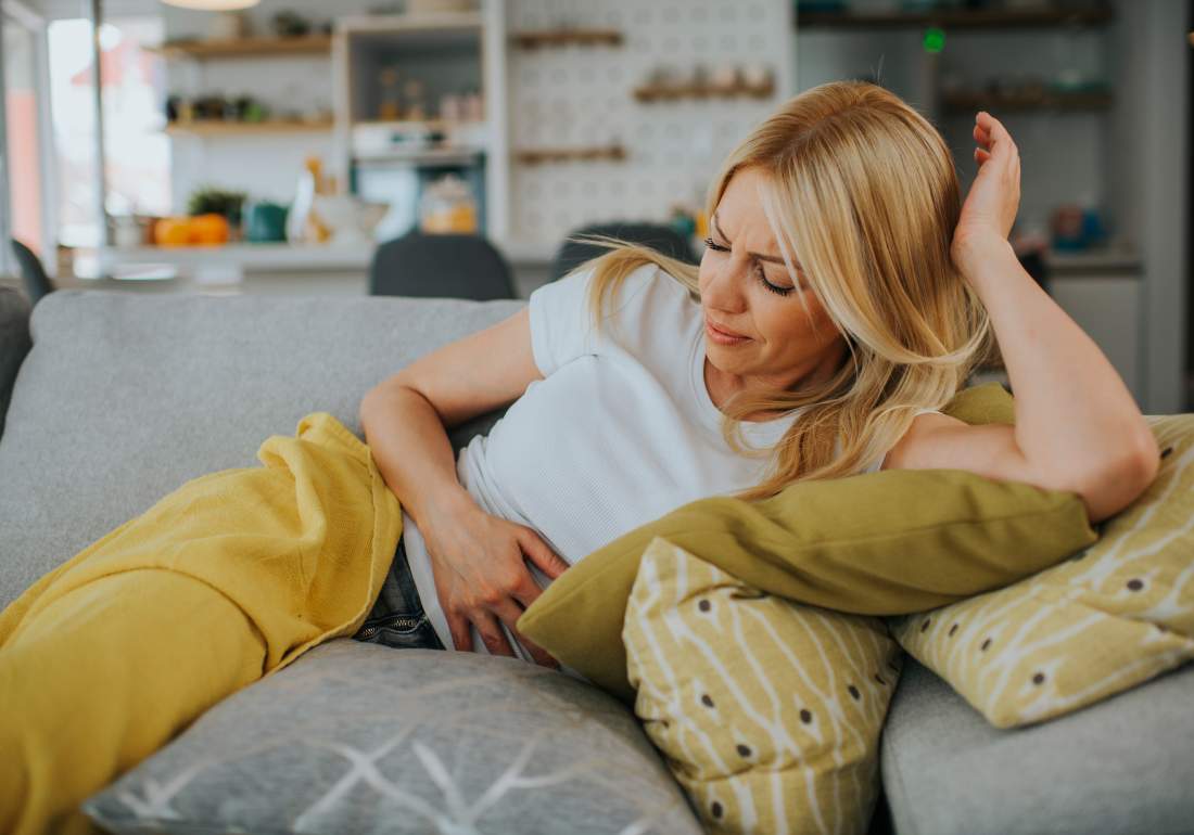 Woman showing signs of discomfort with endo pelvic pain
