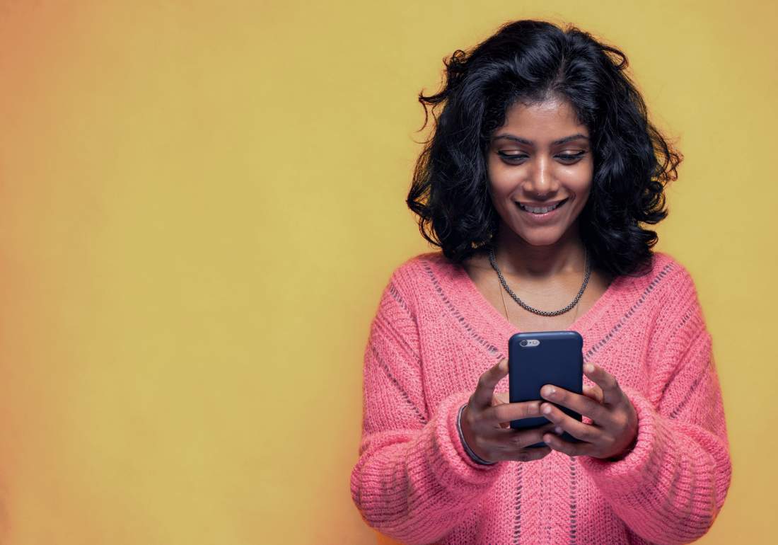Young girl on phone looking for endo diagnosis