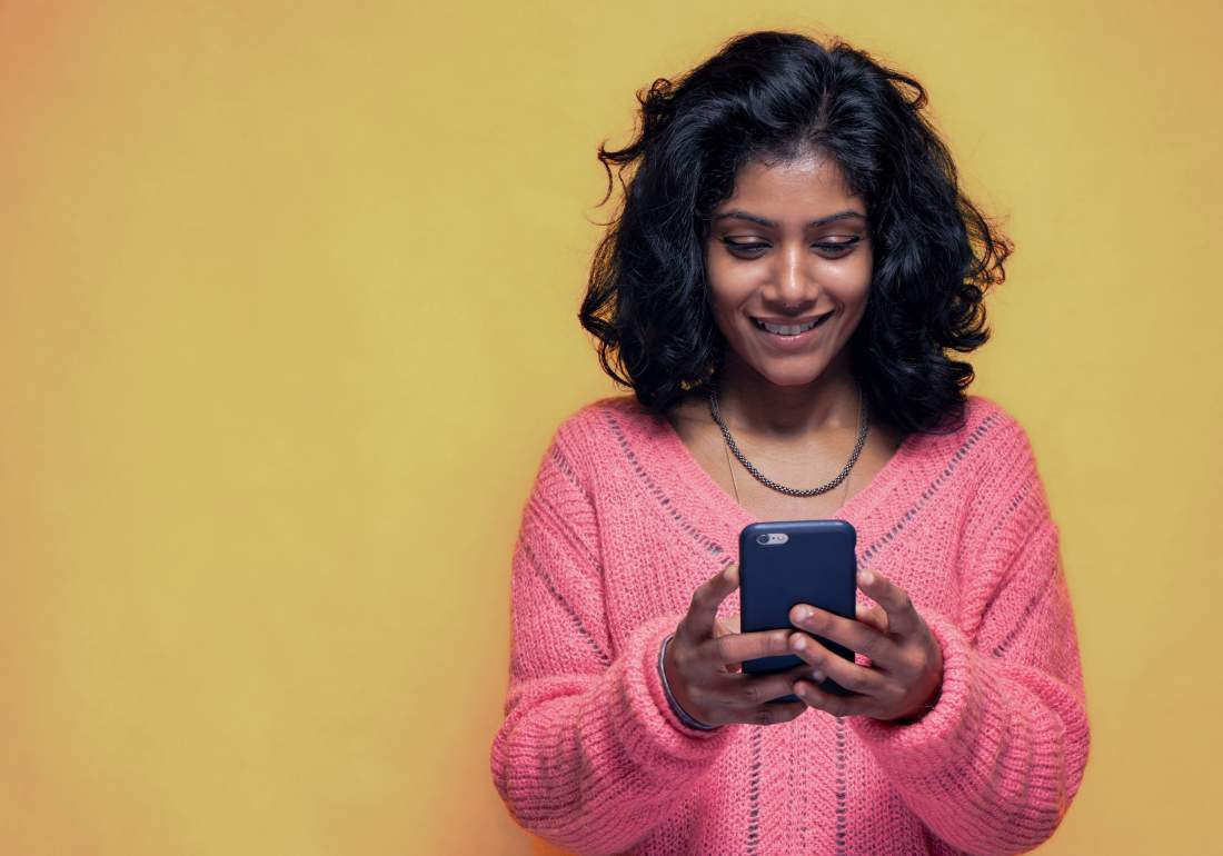 Young girl on phone looking for endo diagnosis