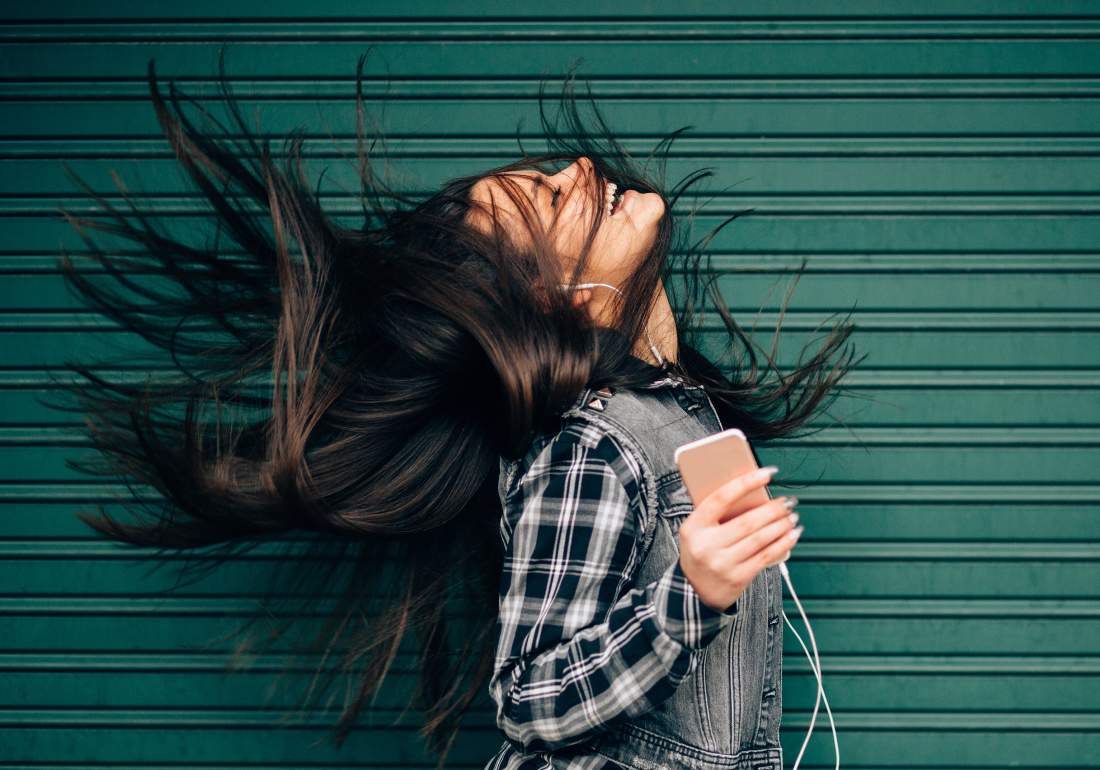 Happy person with diagnosis listening to phone