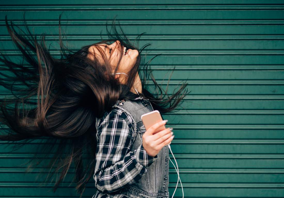 Happy person with diagnosis listening to phone