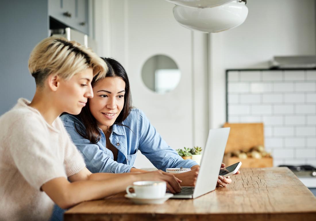 Two women looking at laptop