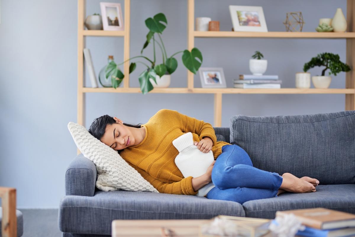 Applying hot water bottle for endo pain