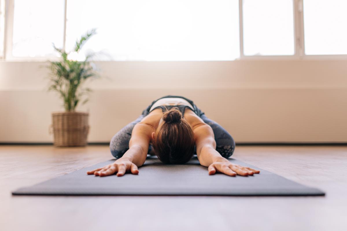 Woman doing gentle yoga stretches for endo