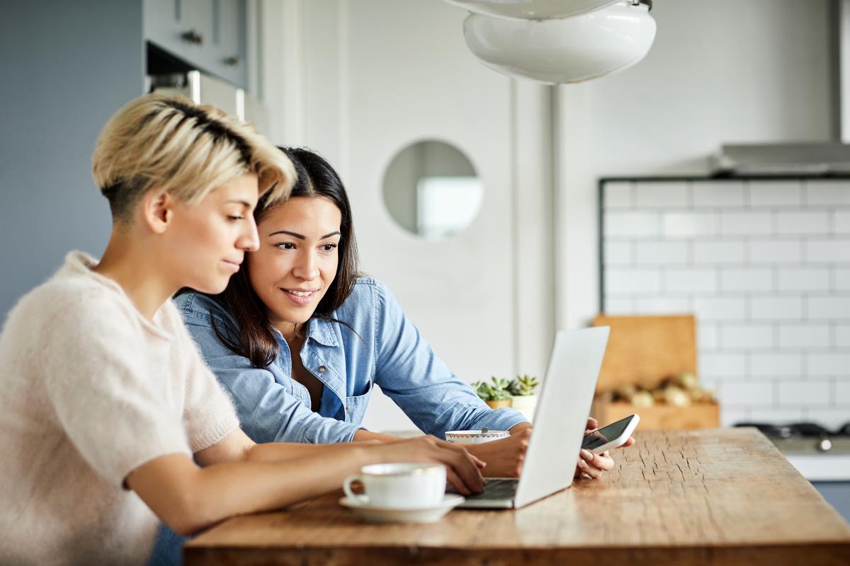 Two women looking at laptop