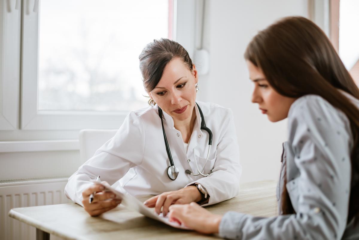 Female doctor talking to patient