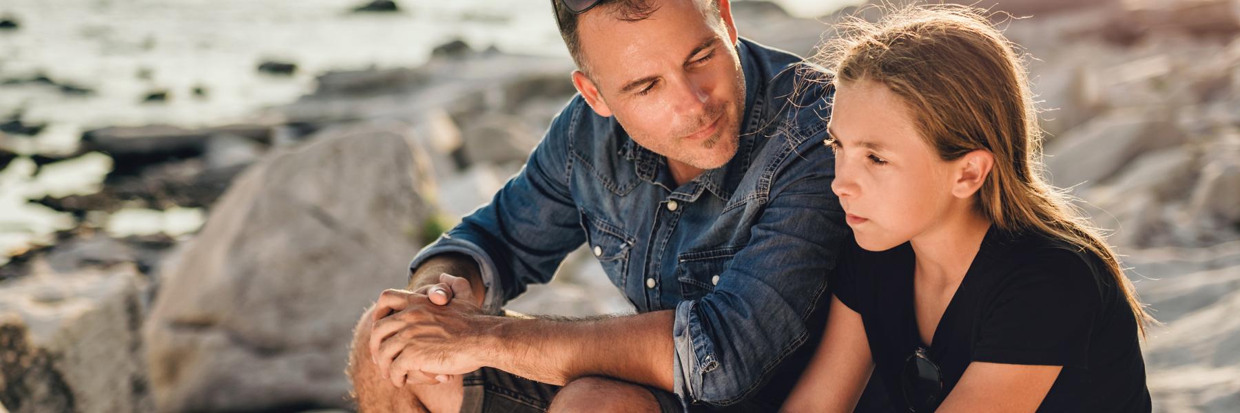 Father sat with his daughter discussing endo symptoms