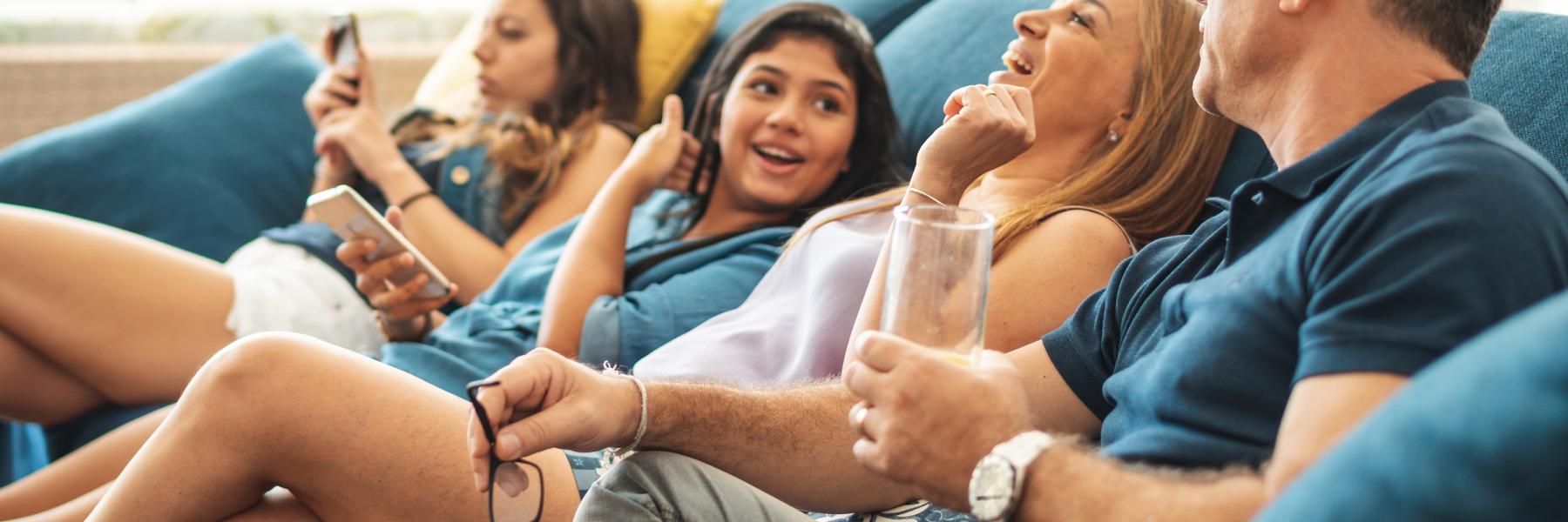 Family talking on sofa
