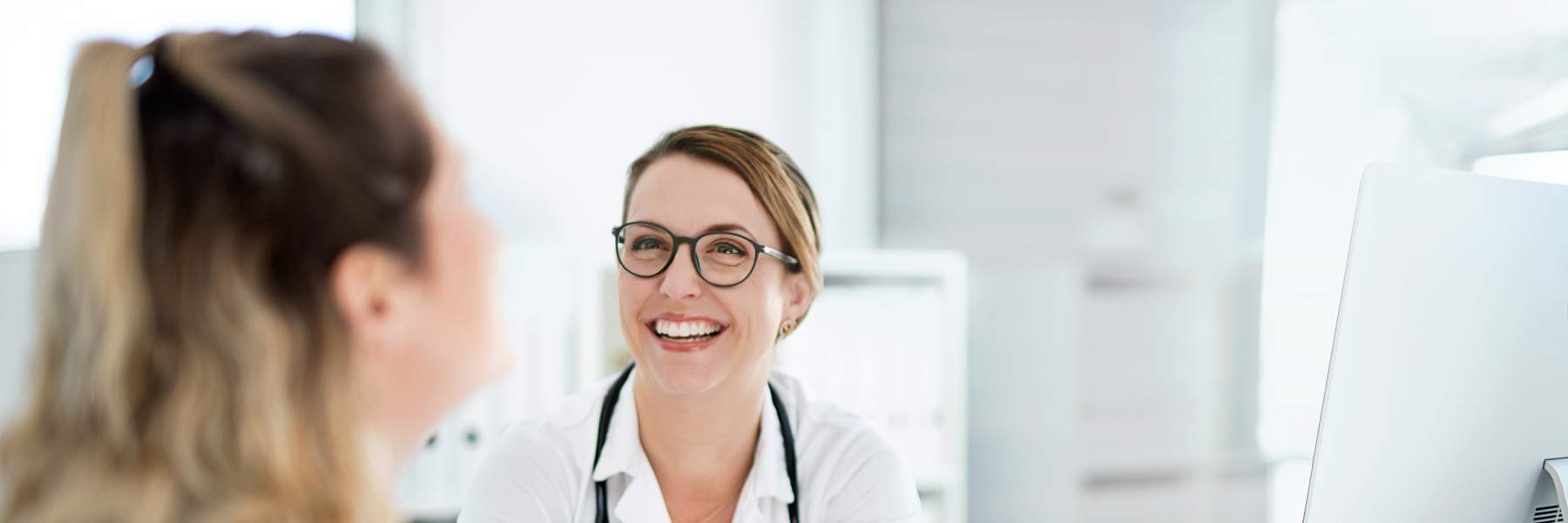 Doctor talking with patient