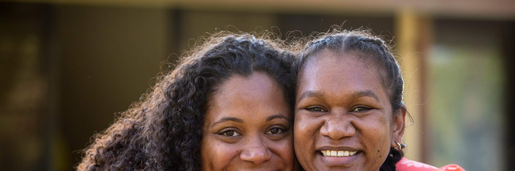Mother and daughter hugging