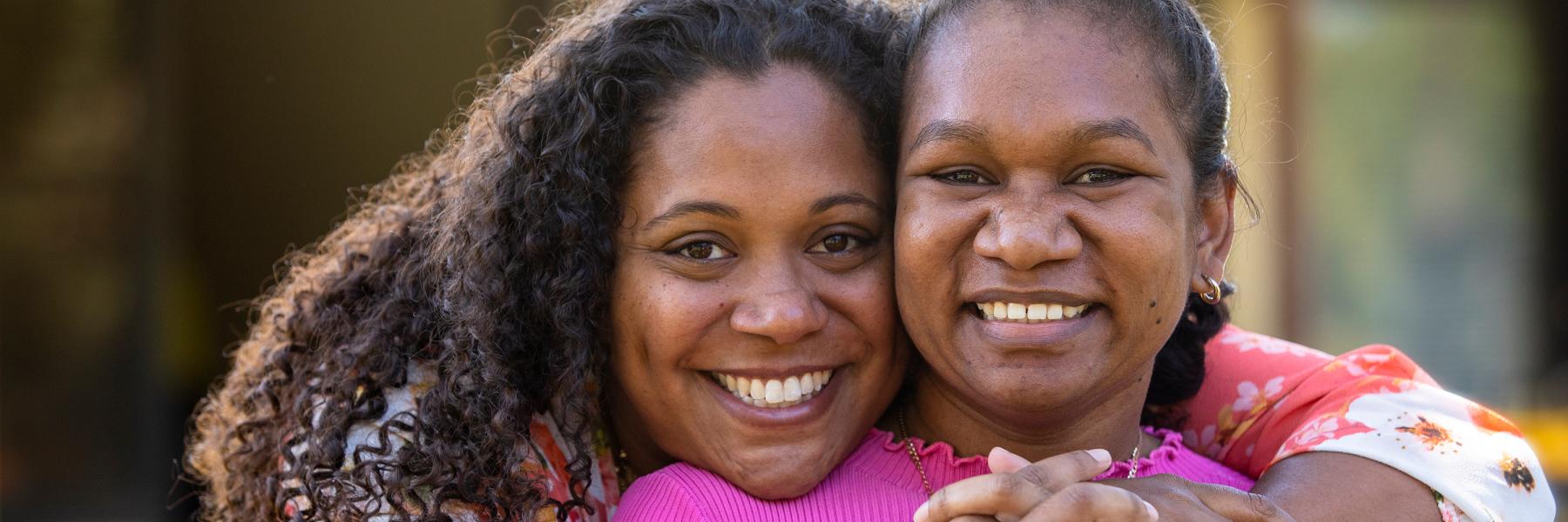 Mother and daughter hugging