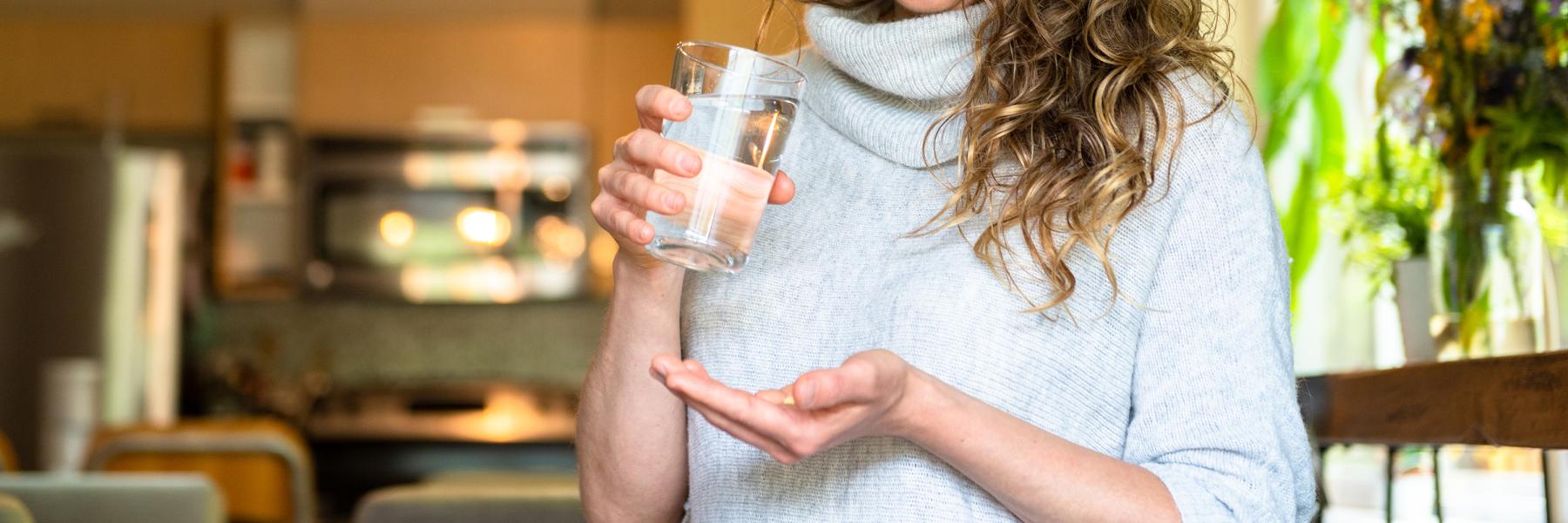 Woman taking medication for endo symptoms