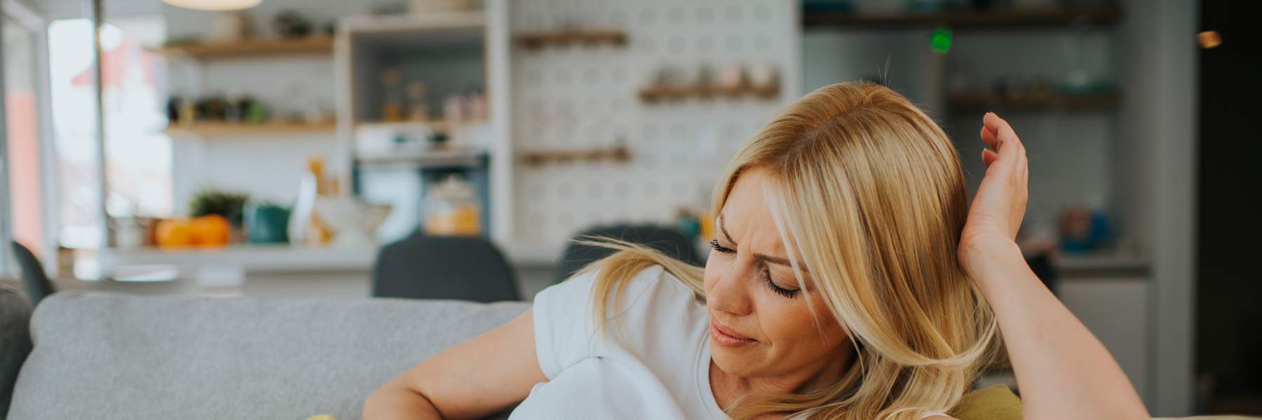 Woman showing signs of discomfort with endo pelvic pain