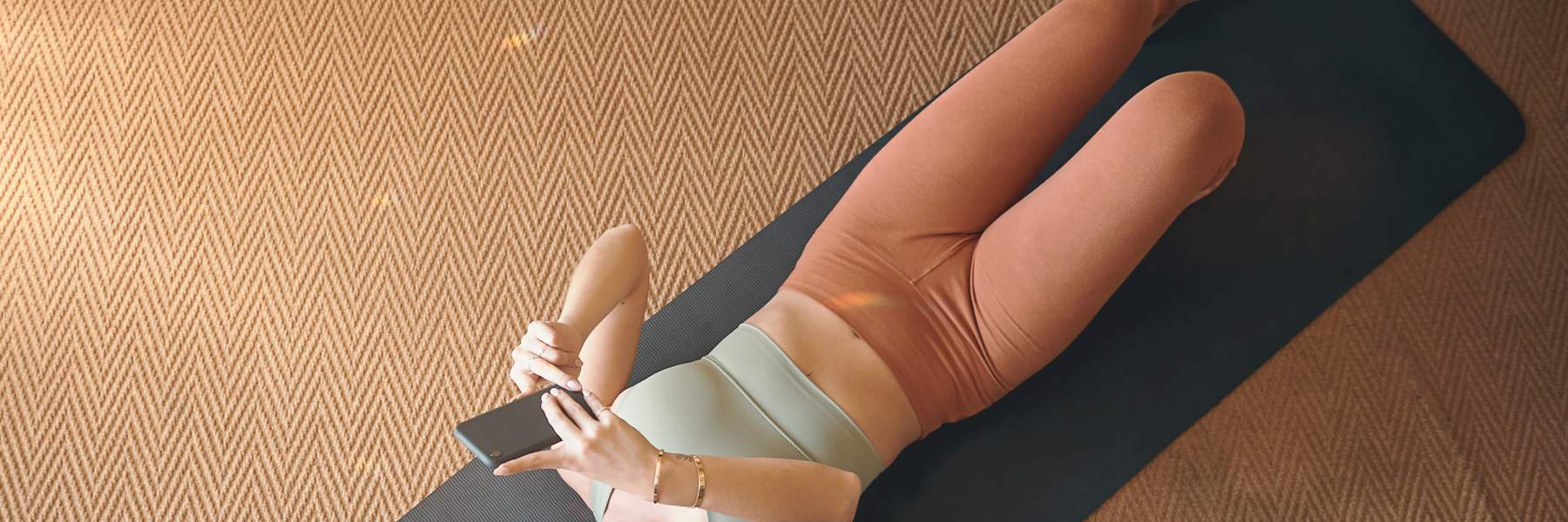 Listening on device to pelvic floor exercises through headphones