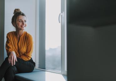 Woman sat at window