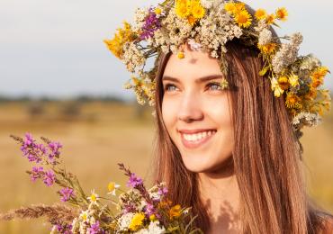 Girl with flowers on hair smiling