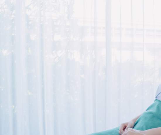 Give sat in hospital bed recovering from bowel surgery