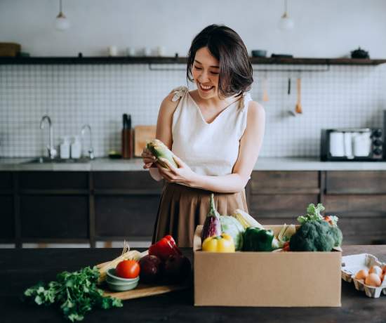 Woman looking at shopping preparing food for a healthy endo diet