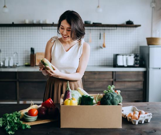 Woman looking at shopping preparing food for a healthy endo diet