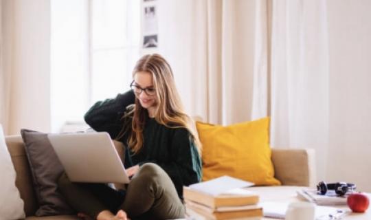 Woman on laptop in living room