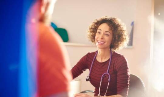 Clinician talking with patient