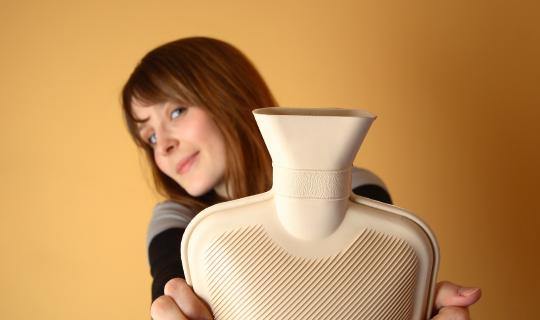 Woman holding water bottle to treat endometriosis