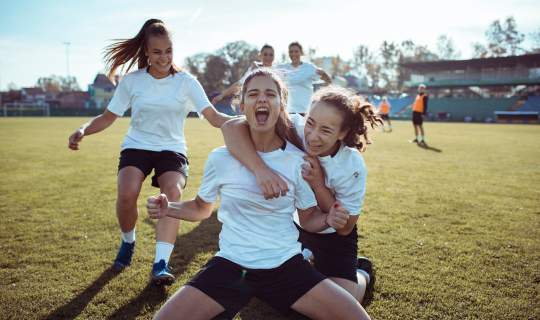 Young girls playing soccer