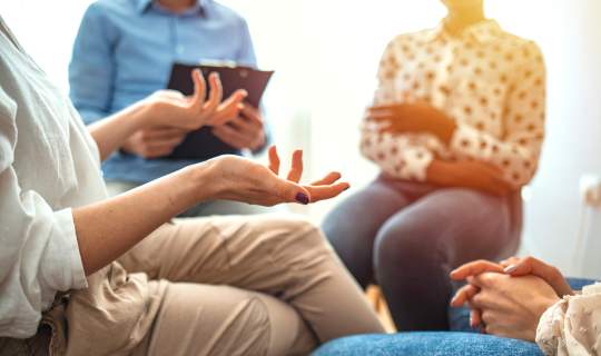Group therapy and support session with people