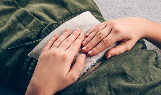 Heat pad being applied for endo pain