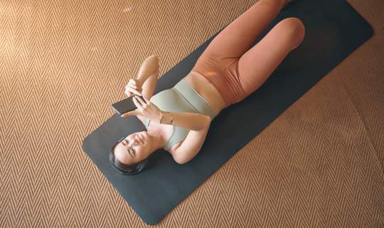Listening on device to pelvic floor exercises through headphones